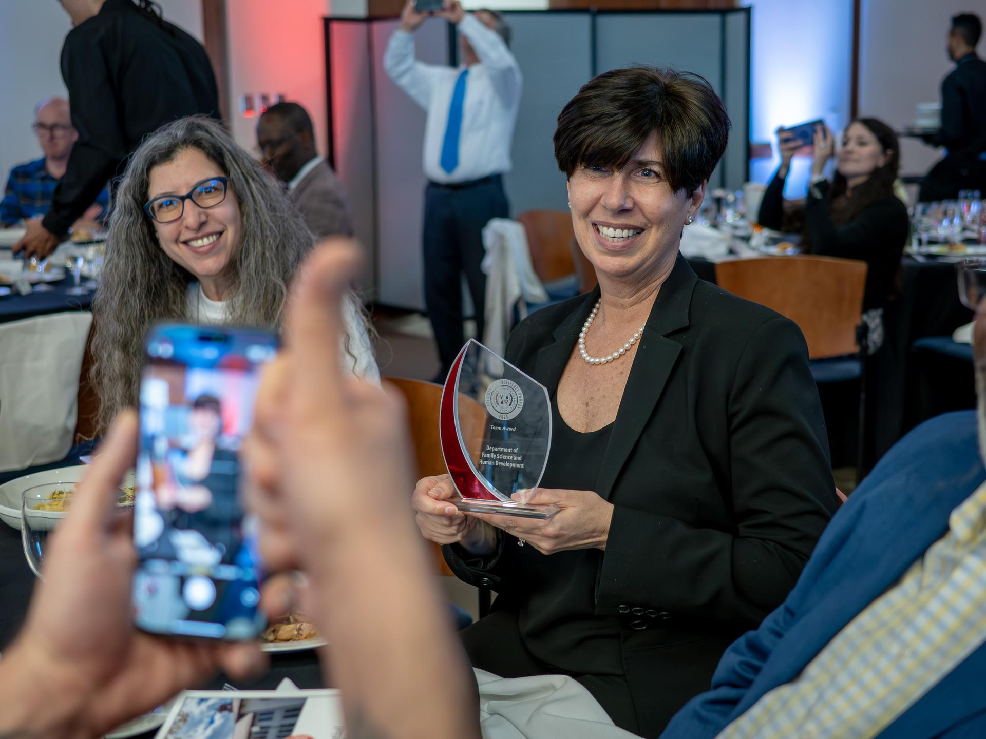 Two attendees celebrating in Presidential Excellence Awards.