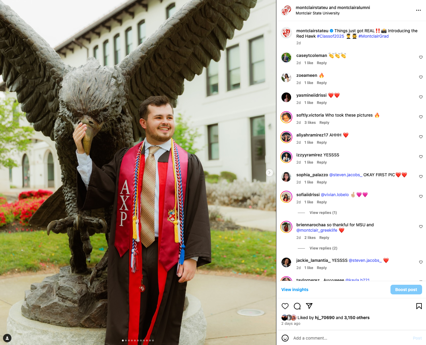 graduate poses on campus with the red hawk statue