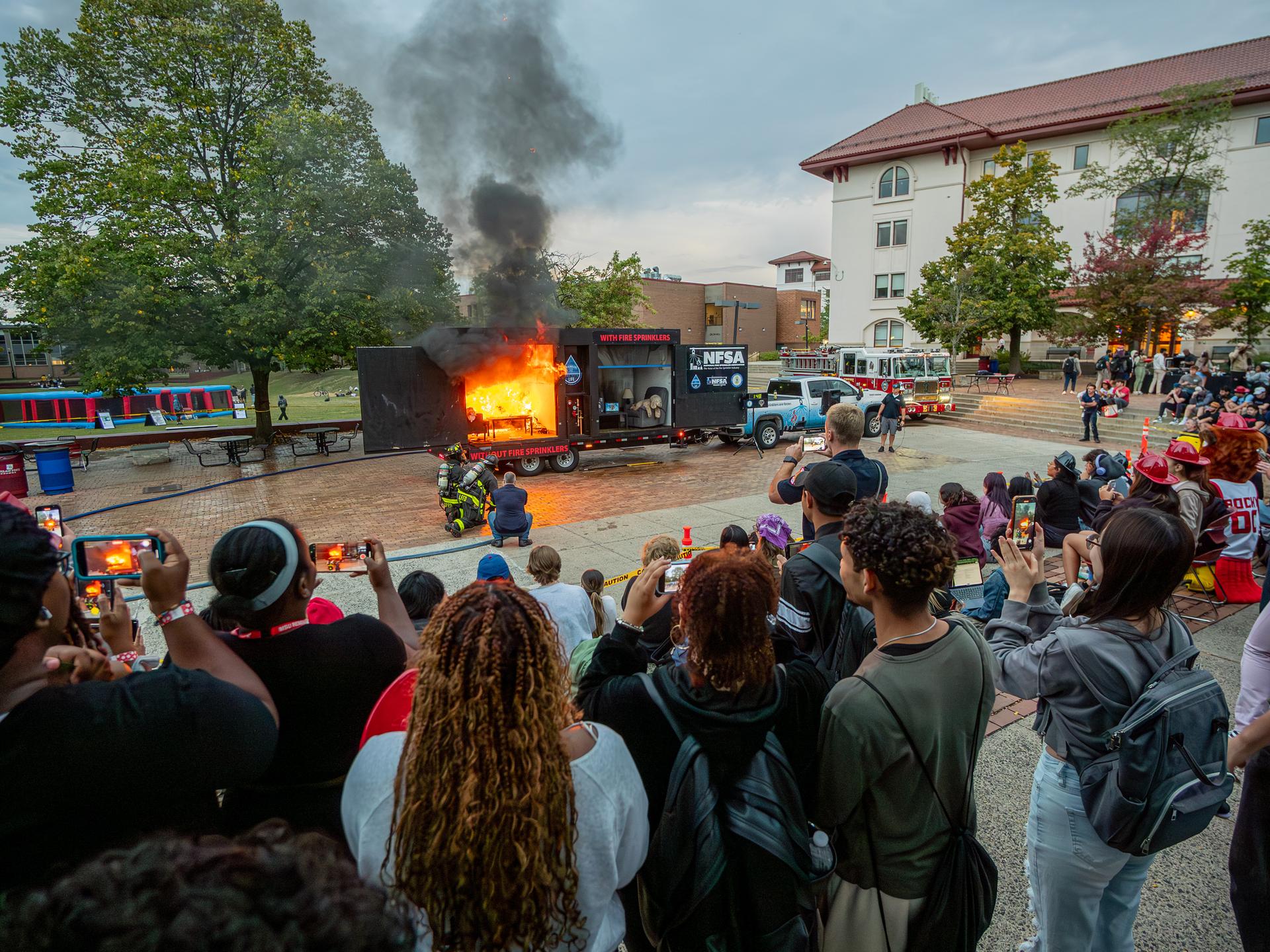 Fire Safety side-by-side burn demonstration of mock dorm rooms.
