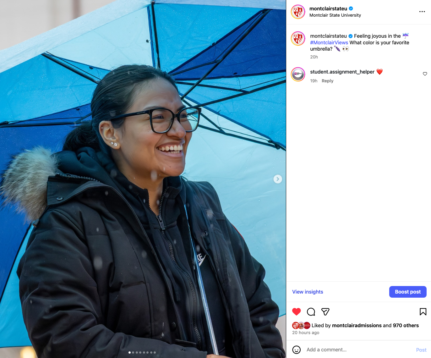 Screenshot of students smiling in the rain under a blue umbrella