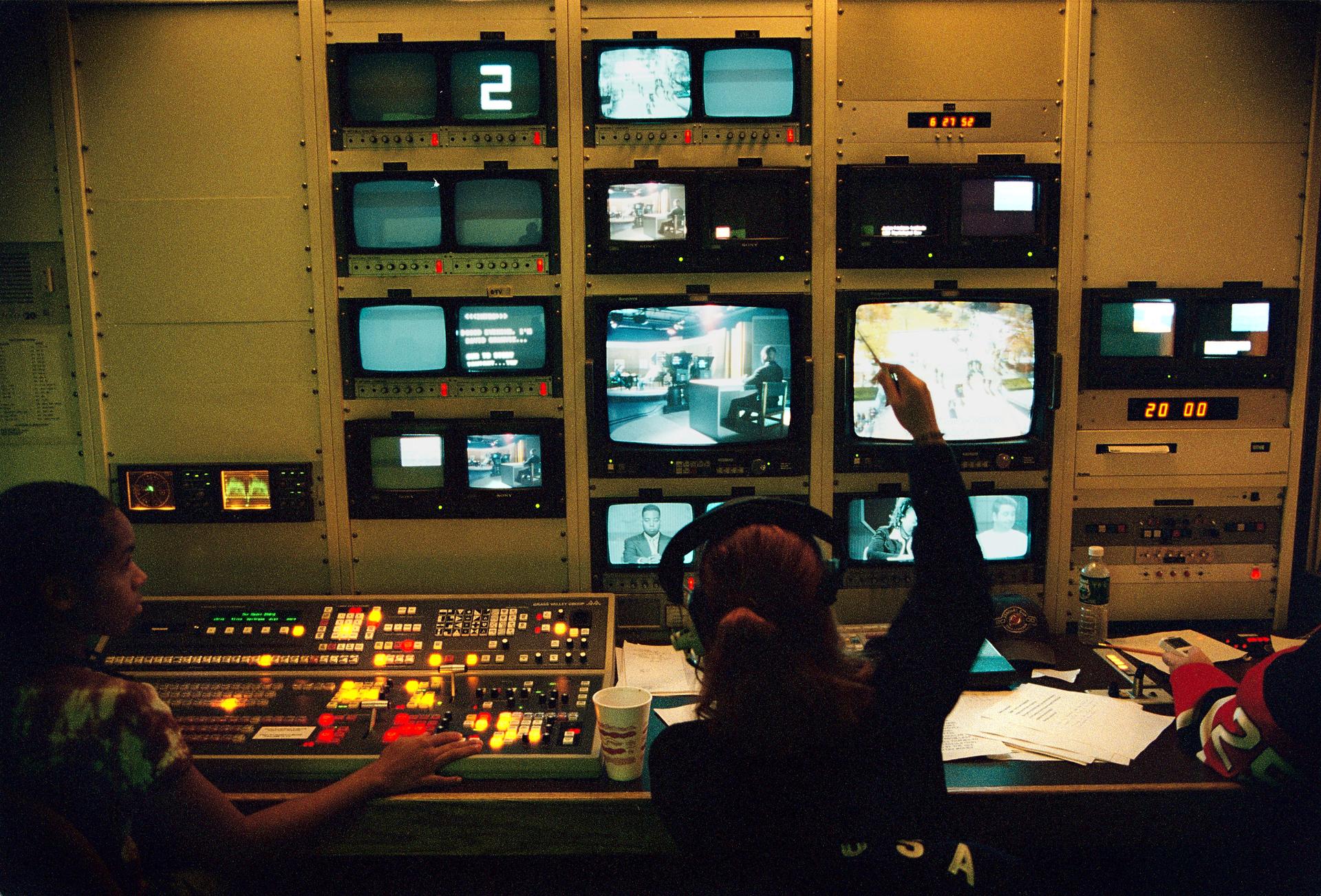 Two people working in the Dumont Television Center in 2002.