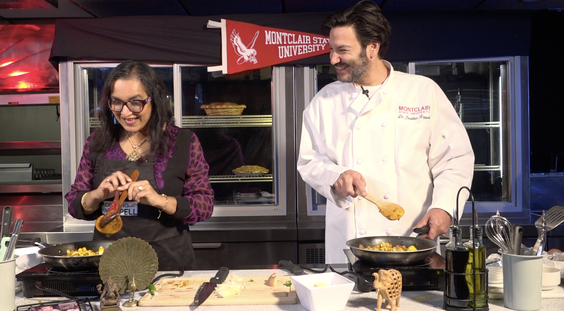 President Koppell and Suda Wadhwani preparing a meal.