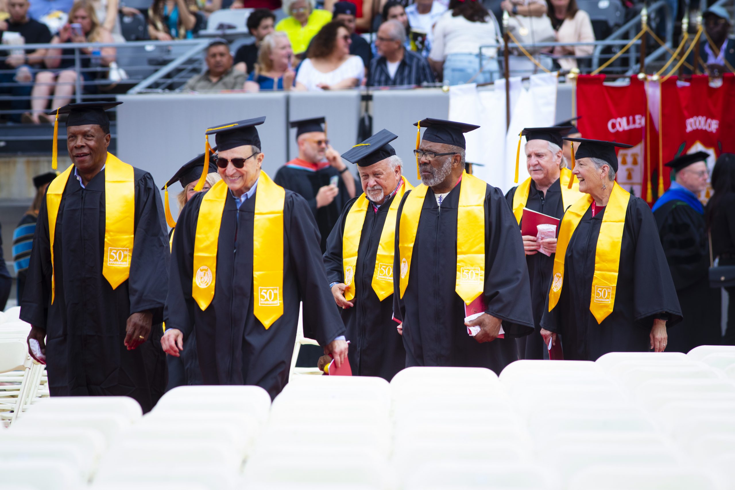 Reunion group walking at Commencement.