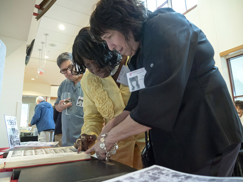 Women looking at yearbook