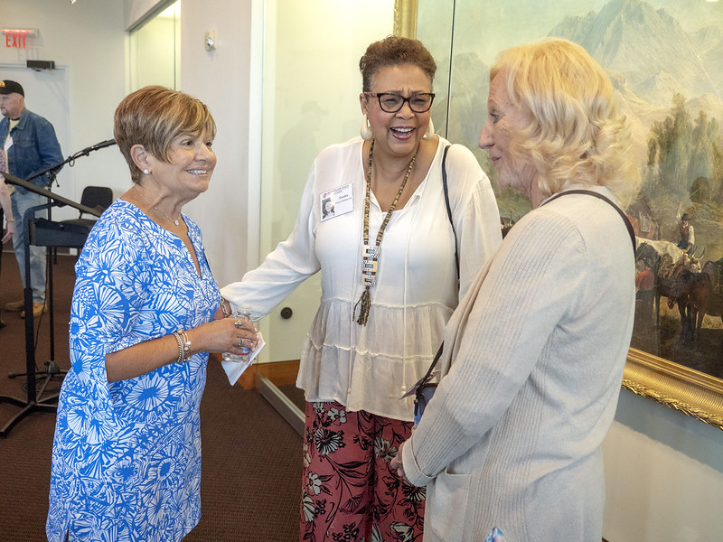 Three women laughing together
