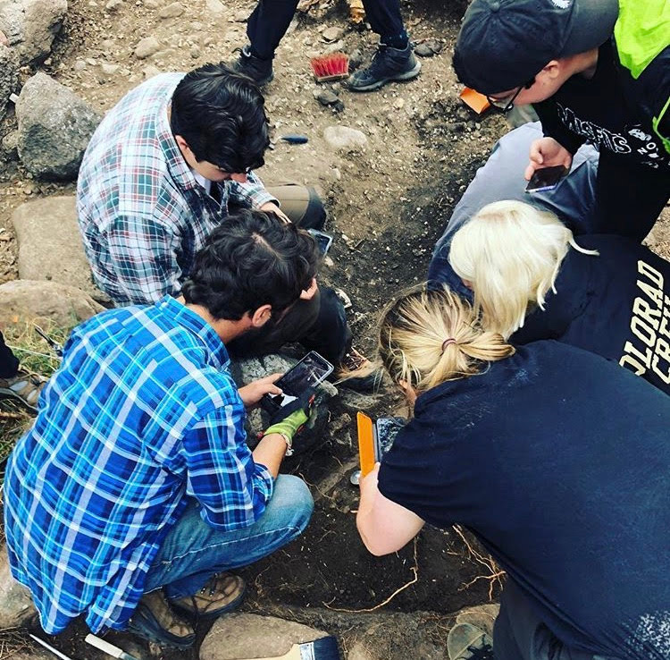 Students in Scotland studying artifacts