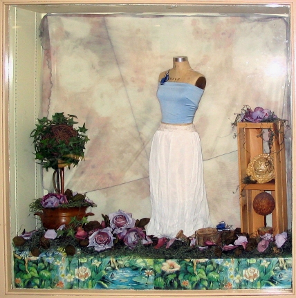 blue top and white skirt on display