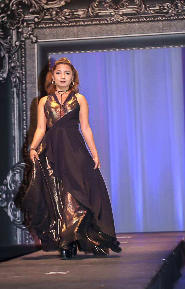 woman in gold and black dress