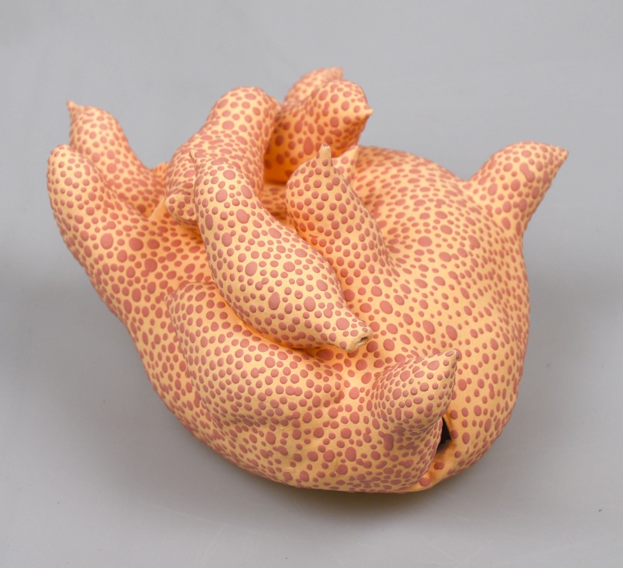 yellow and orange bird sculpture