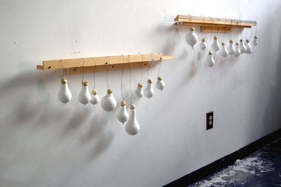 sculpture with hanging bulbs