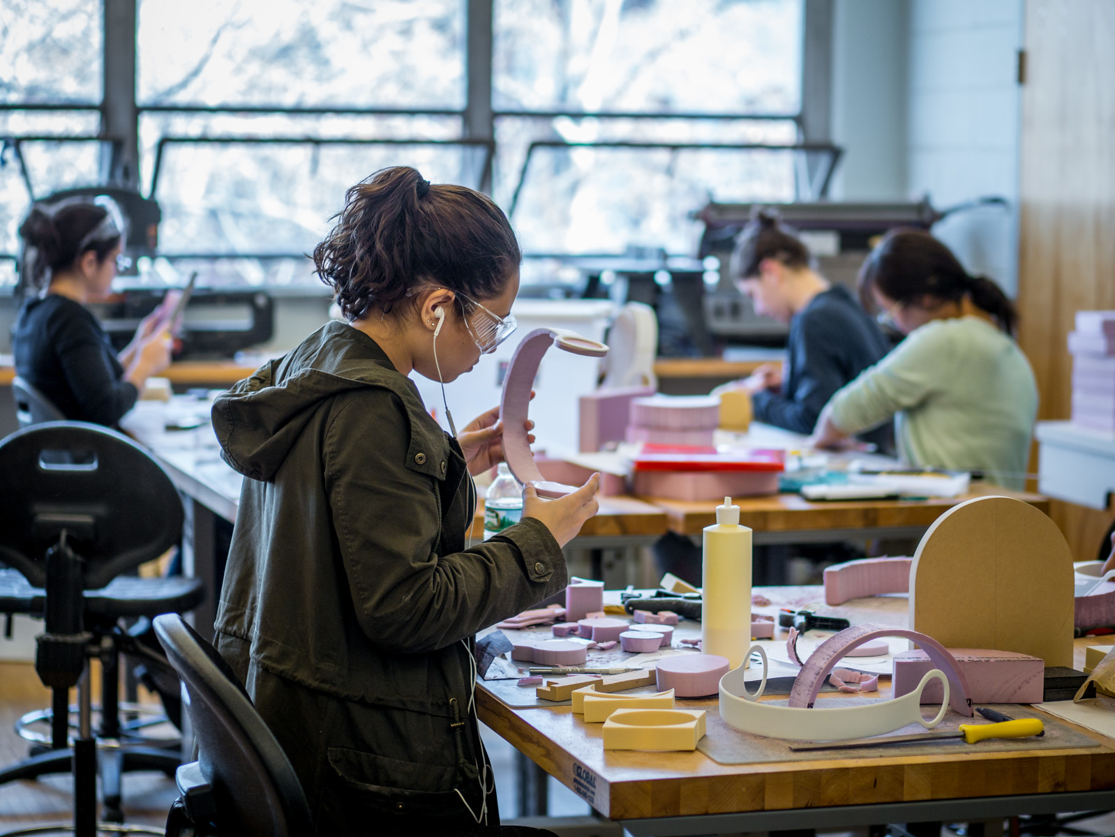 product design students building mockups in studio workspace