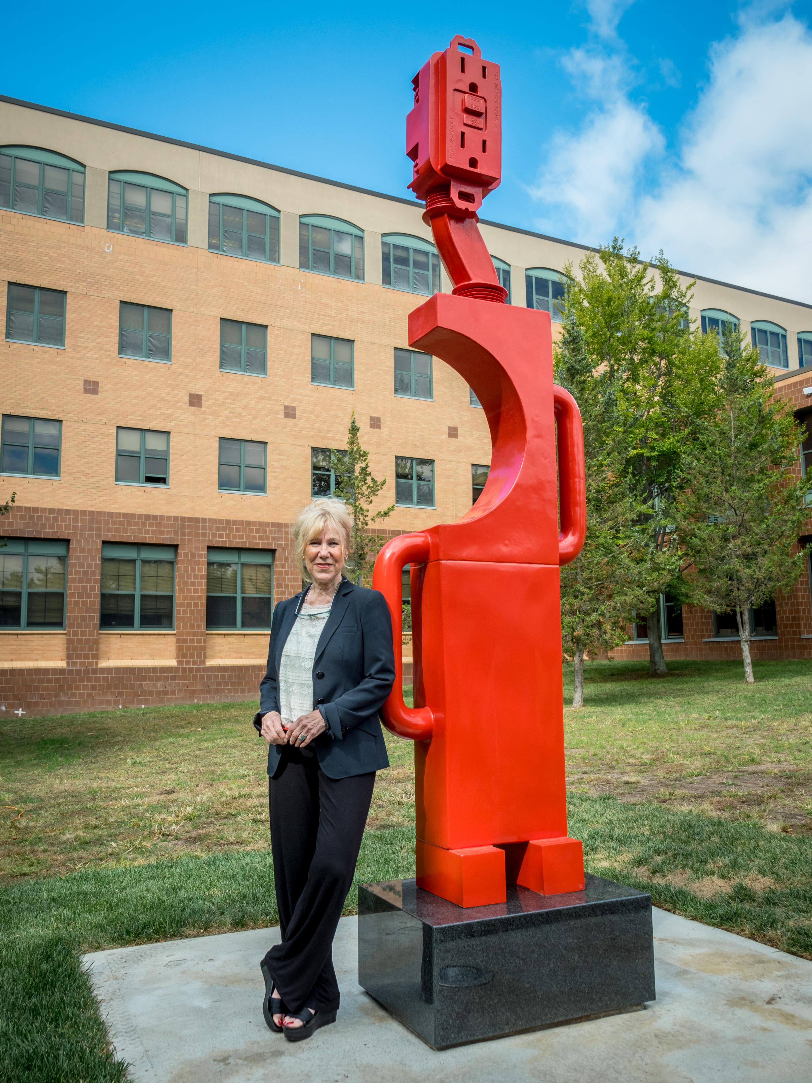 Artist Carol Brown Goldberg with "Secret Totem."