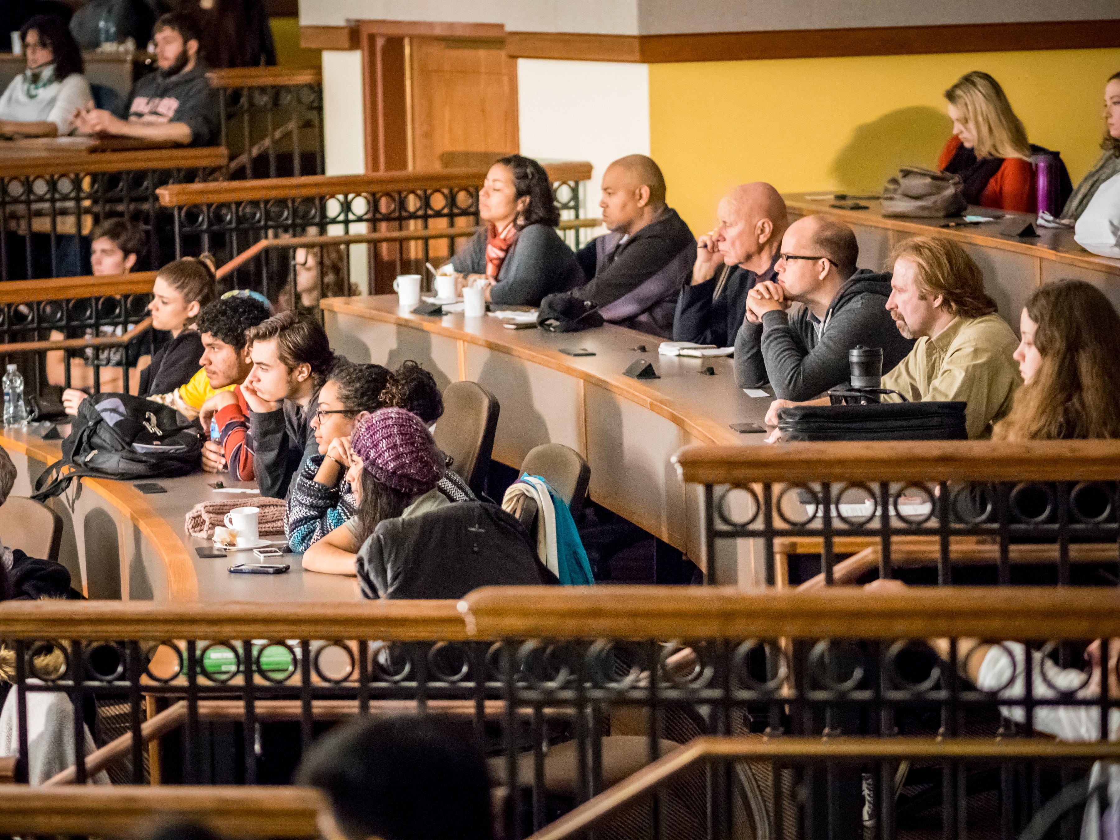 An audience of students and community members at the 2015 Behind the Screen event.