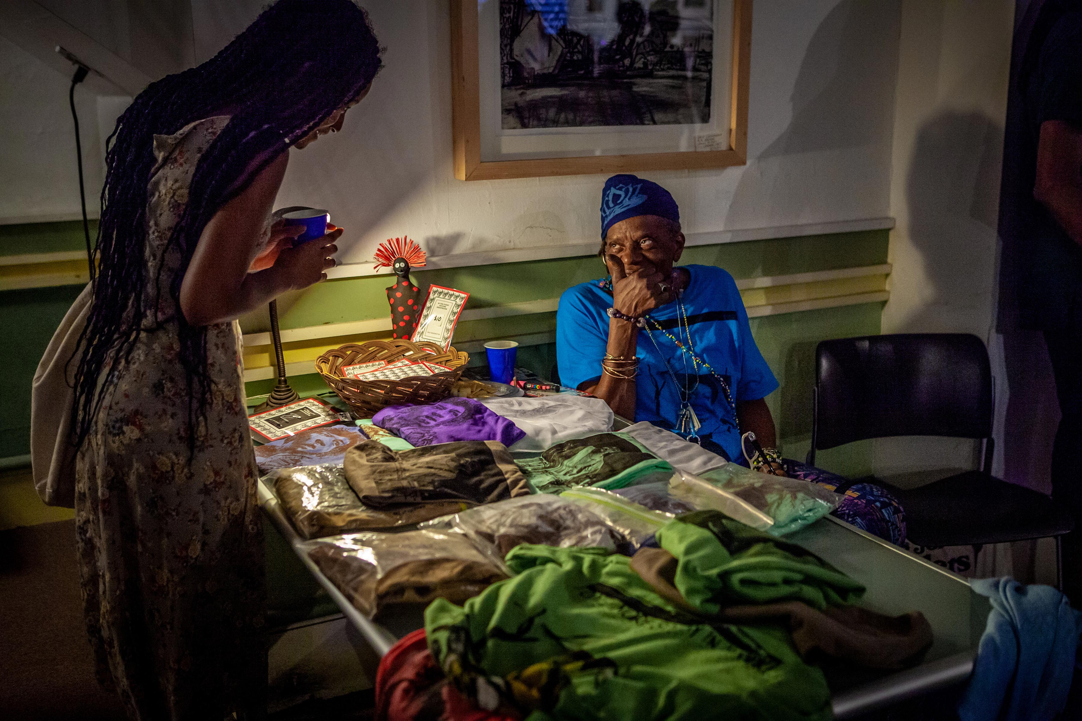 woman at table showing textile arts