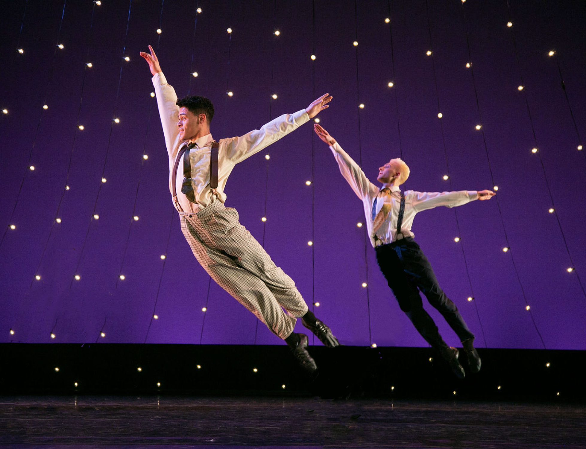 Image of students dancing on stage, promoting Spring Dance 2023