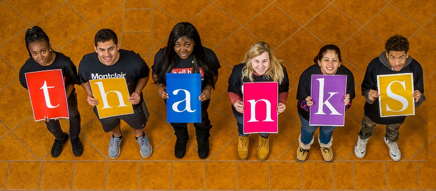 Photo of students holding a banner that says THANKS