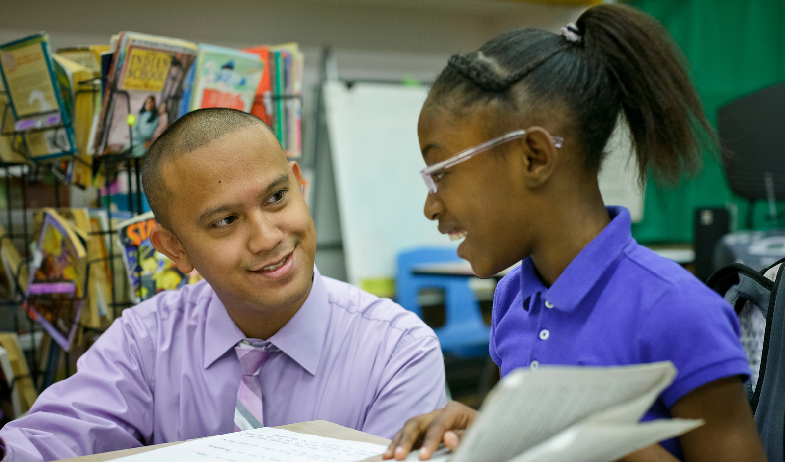 Student teacher working with elementary student
