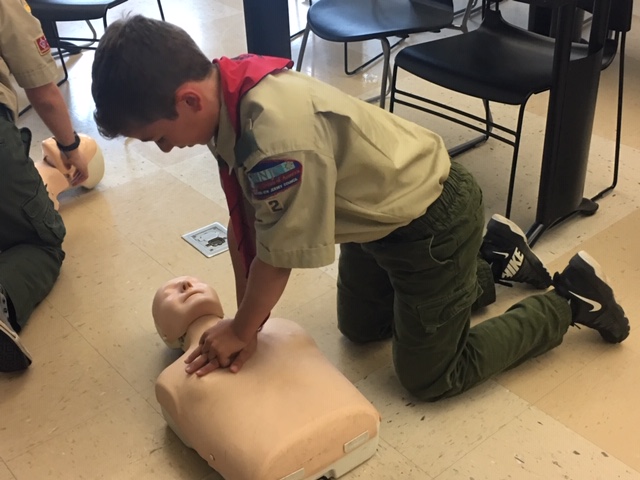 scout learning CPR