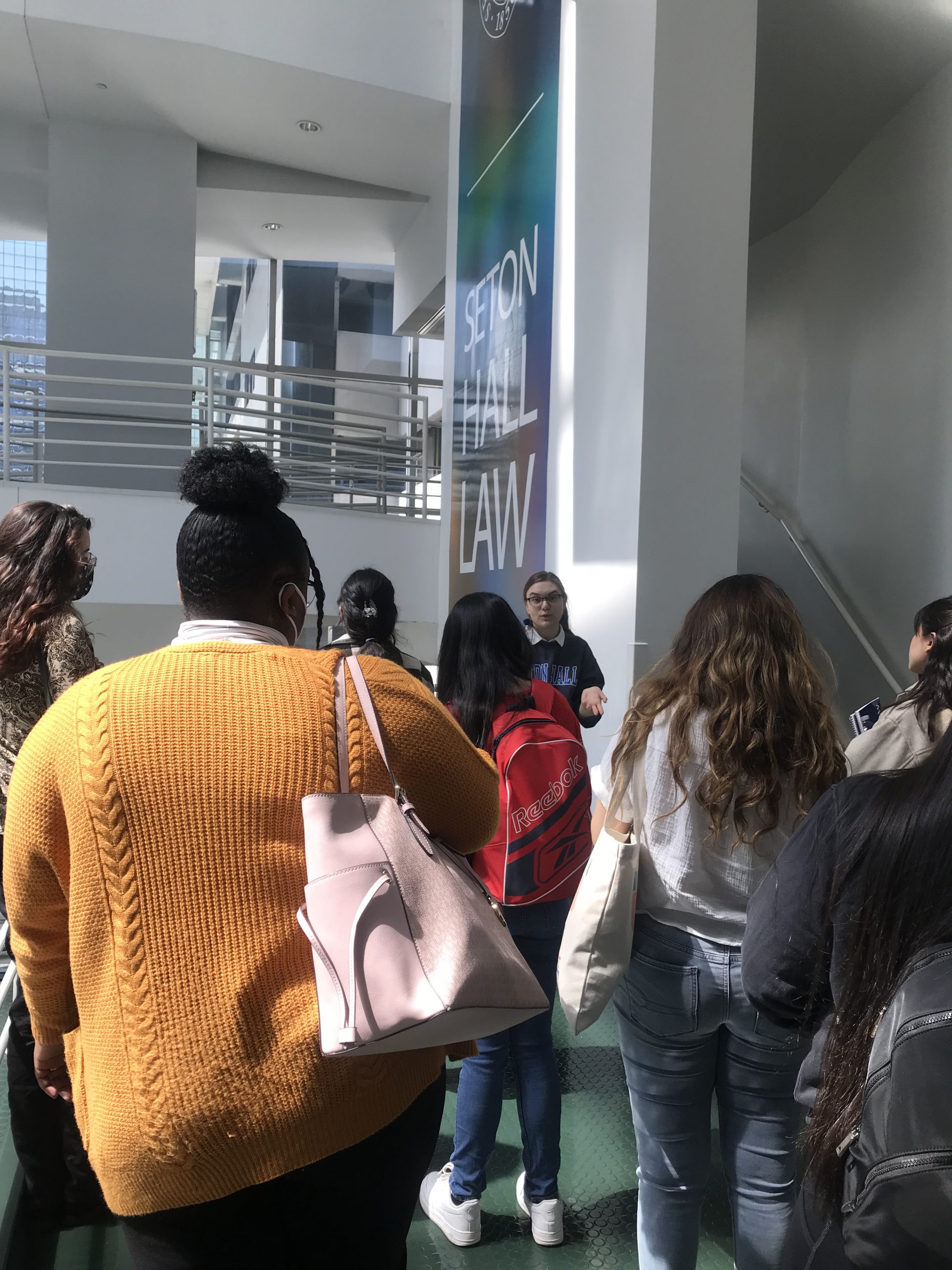 A group of students with a tour guide at Seton Hall Law School