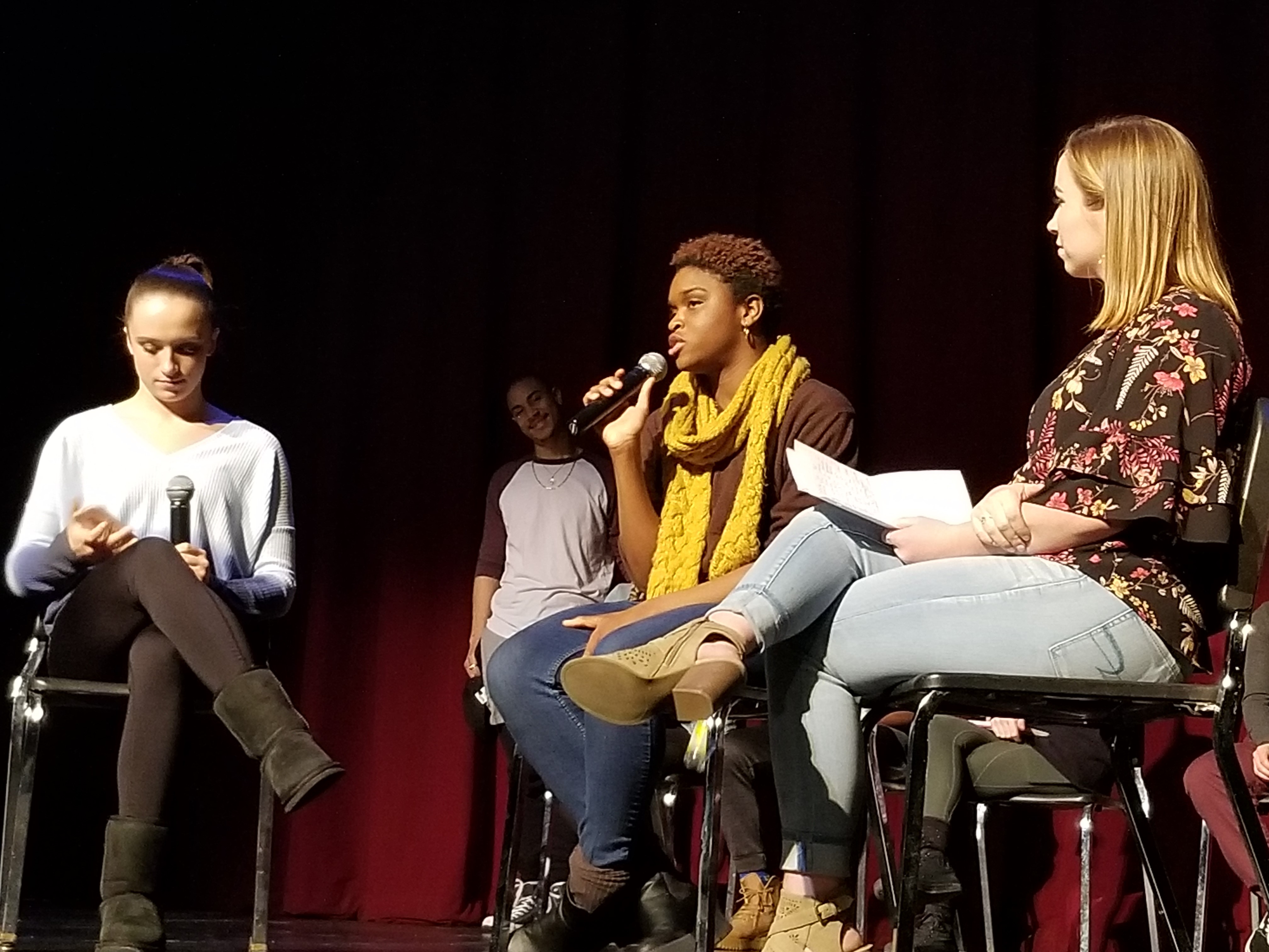 Student choreographers discussing Dance Collage