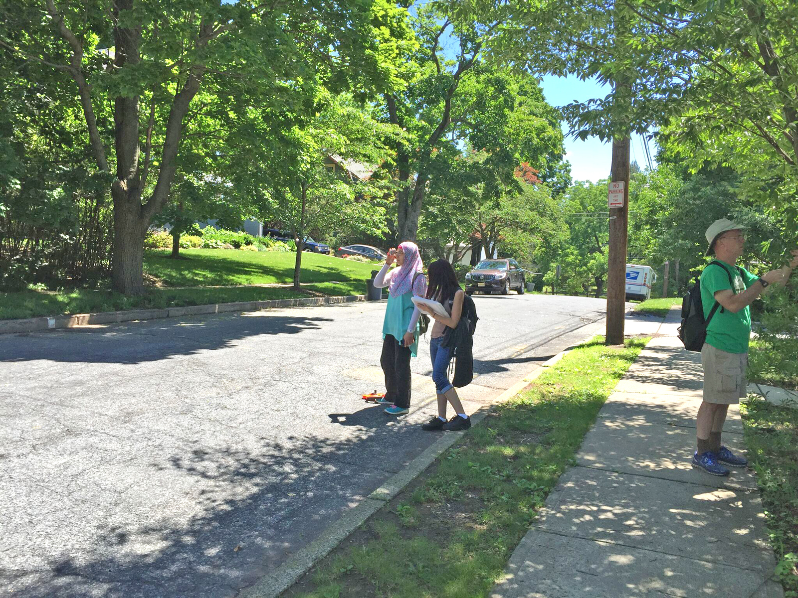 Norhan, Doriann and Dr. Vanderklein finding the height of a tree