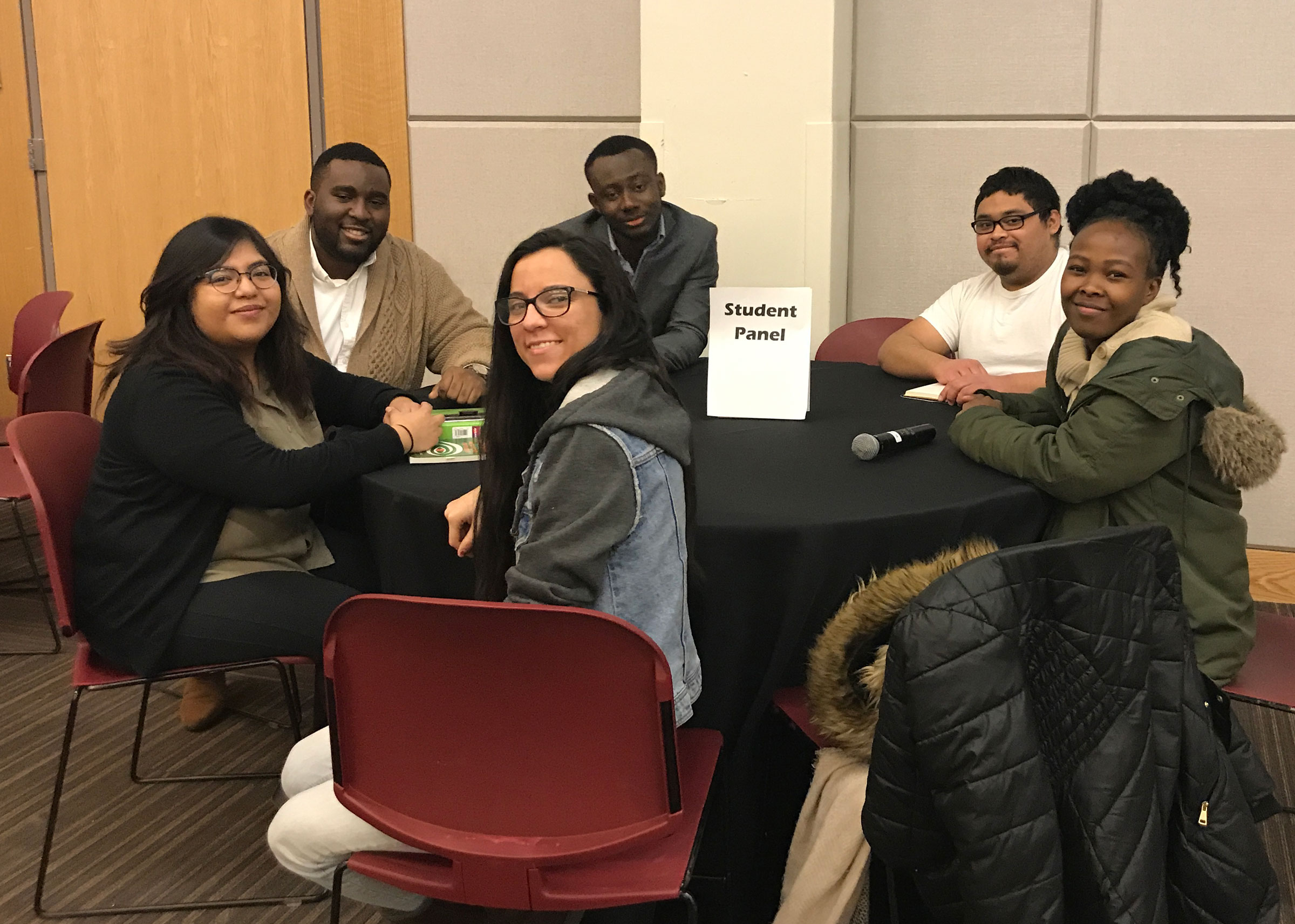 Students at their table during the panel discussion