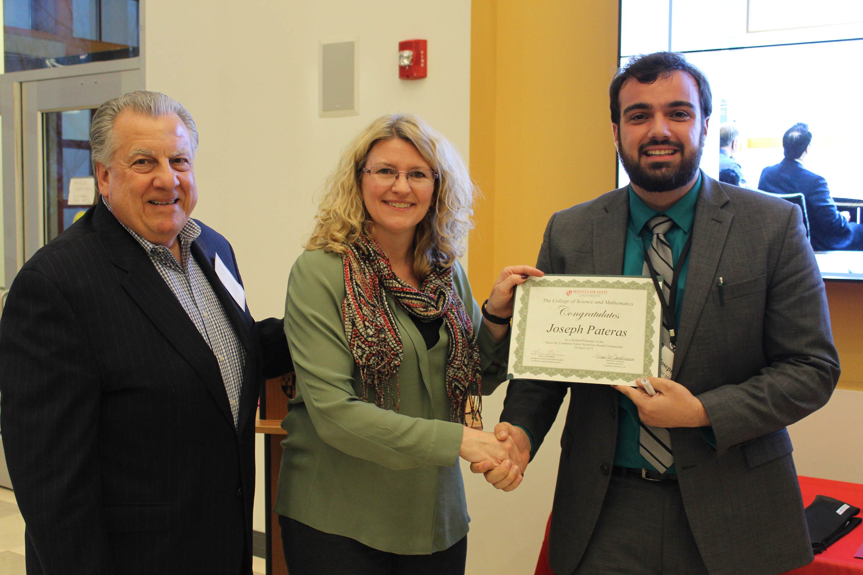 Joseph Pateras receiving participation award