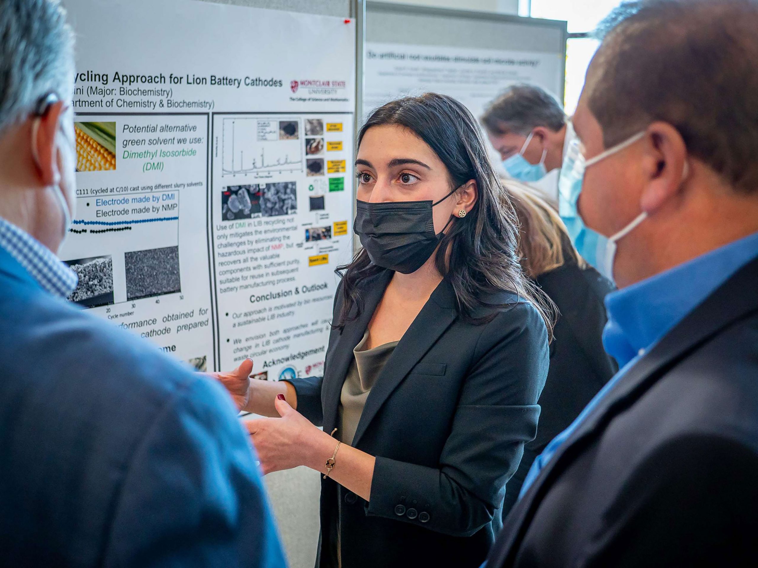 Kayla Mancini explaining her research during the poster session
