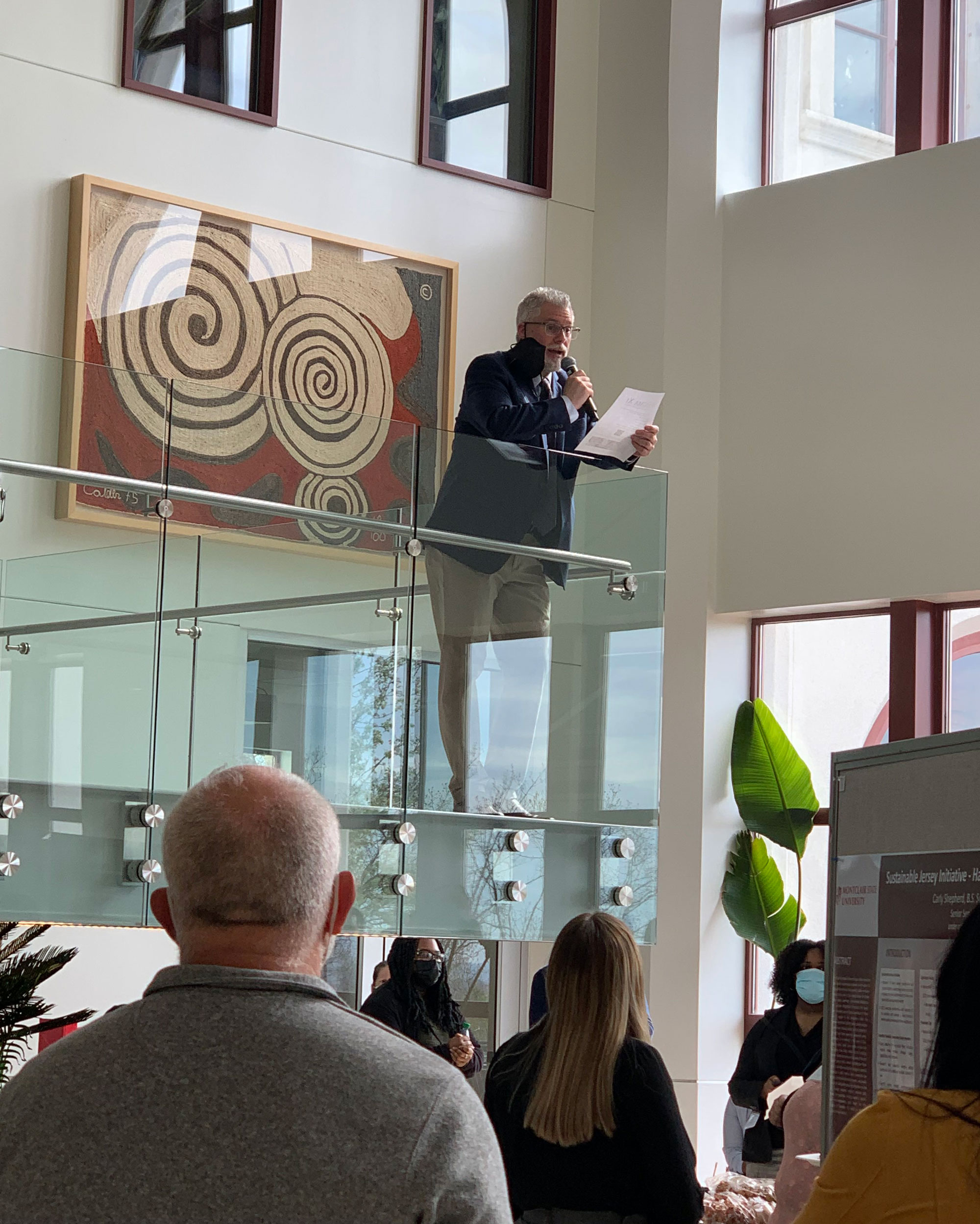 Associate Dean Kight talking to attendees from stair landing