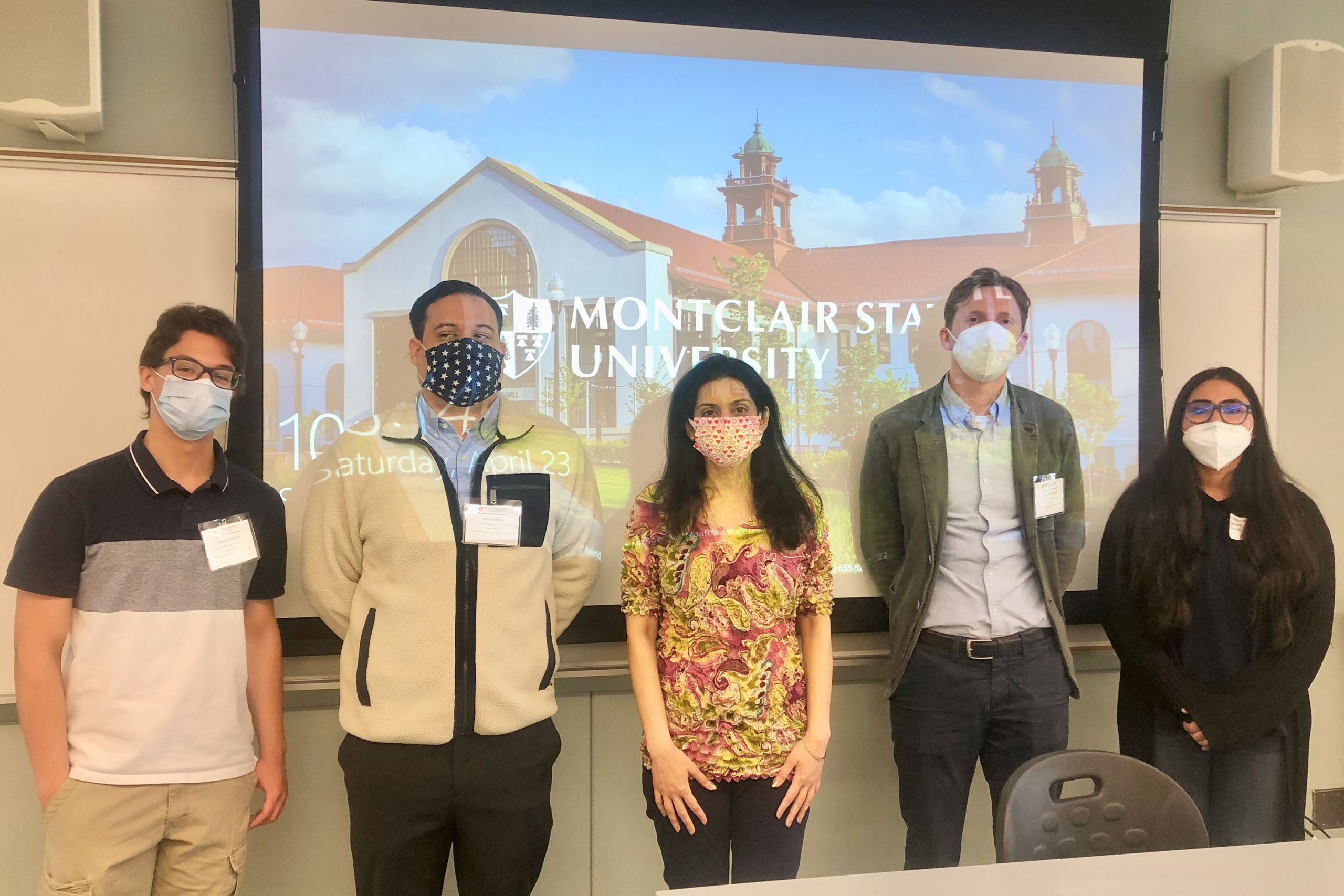 Dr. Varde with her students participating in the symposium