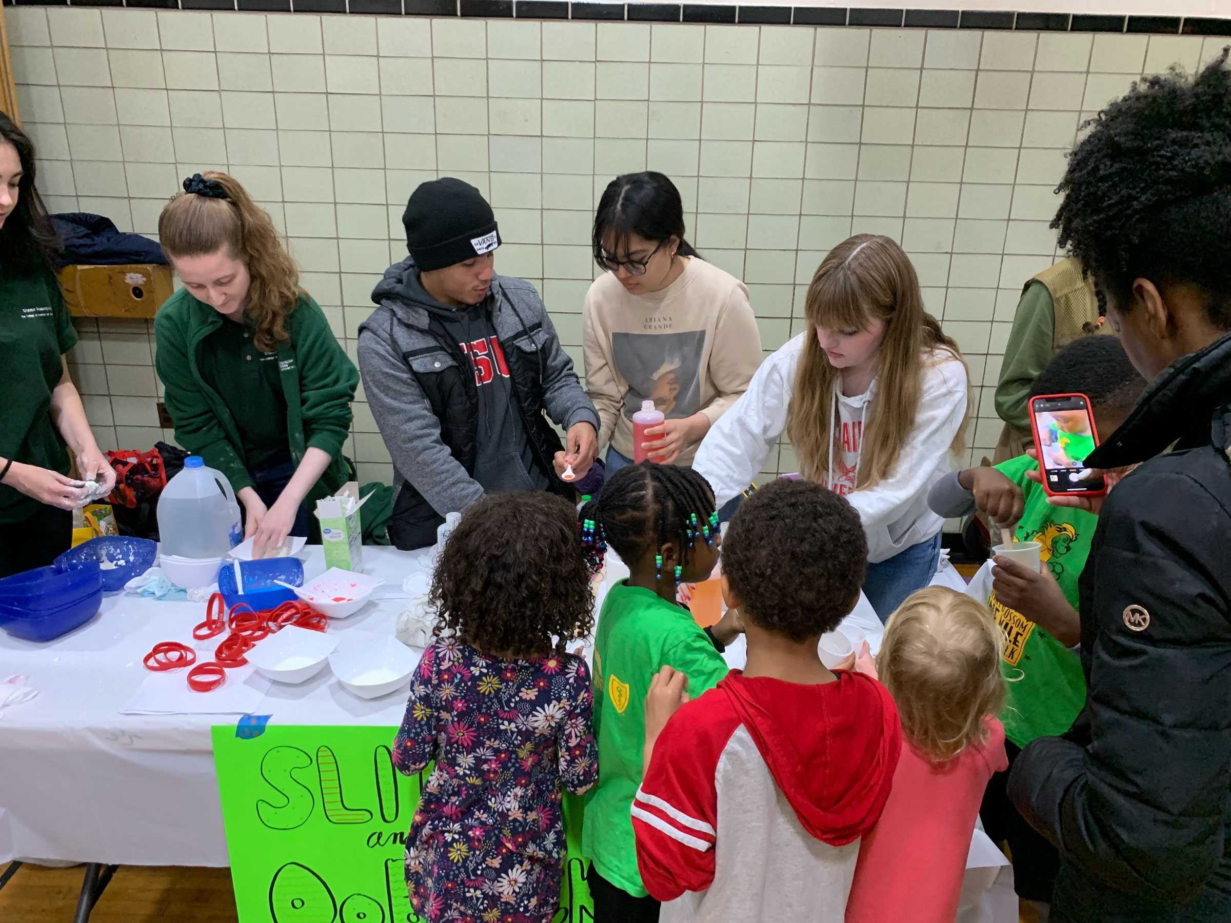 elementary school students at Chem table