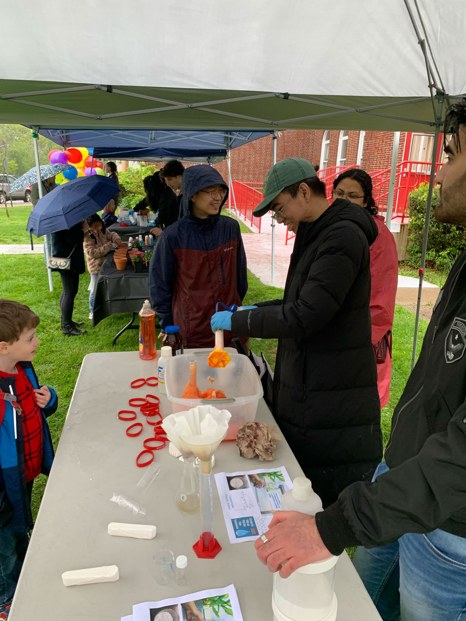 elementary school students at Chem table