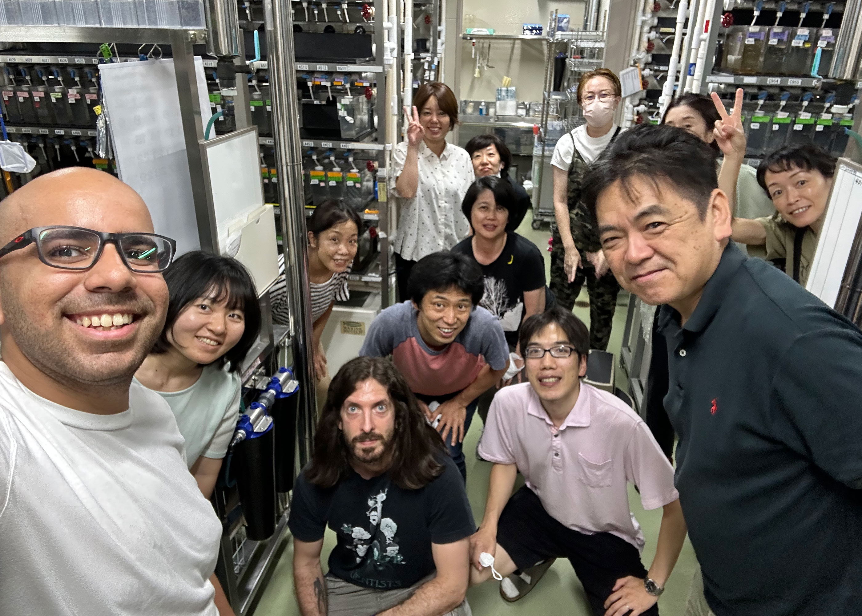 Edwin taking a selfie with his lab team