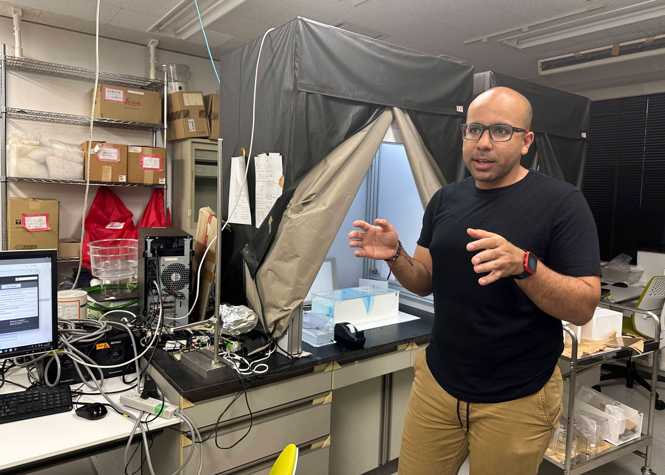 Edwin discussing his experiment in the lab