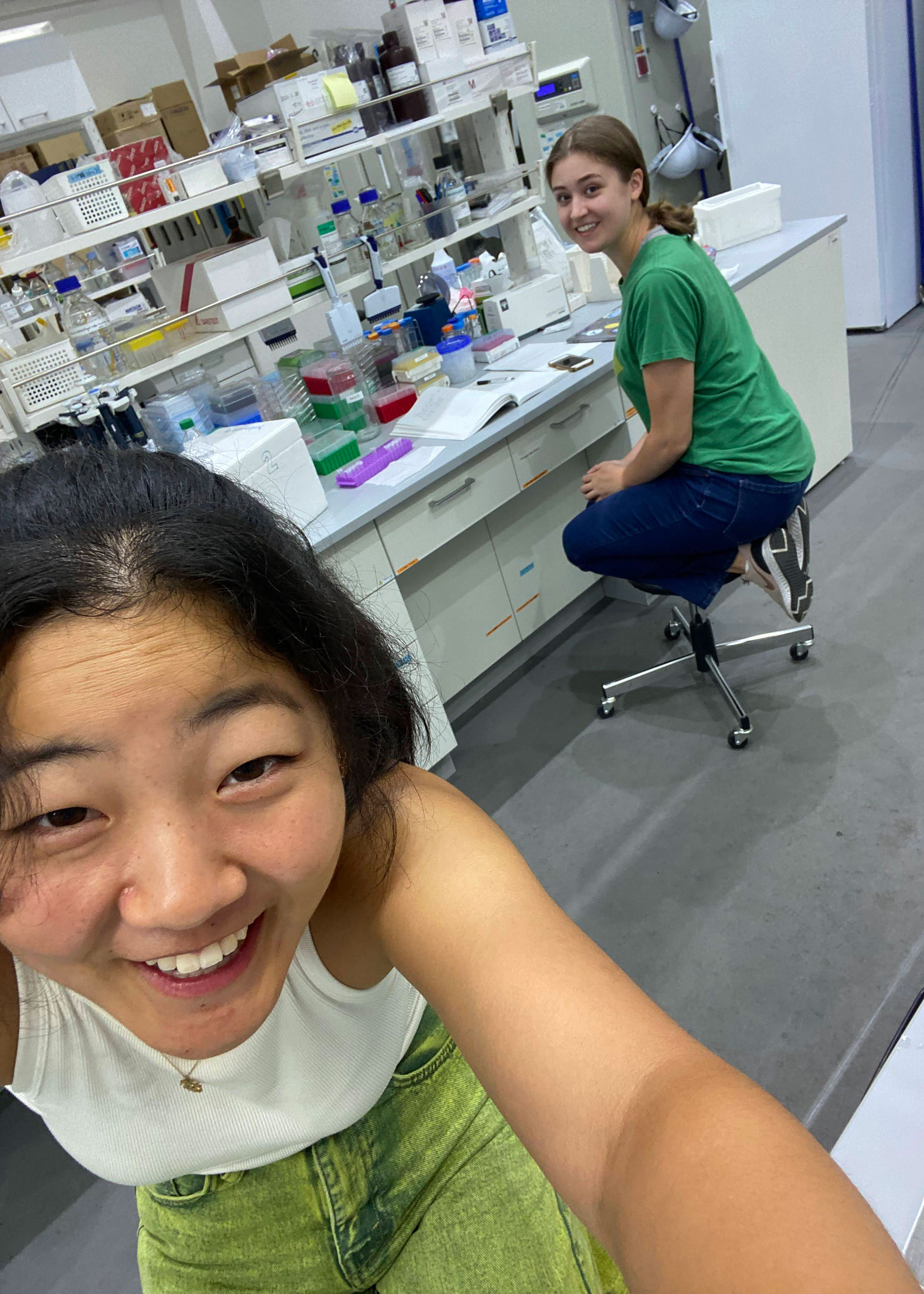 Samantha taking a selfie in the lab with a colleague