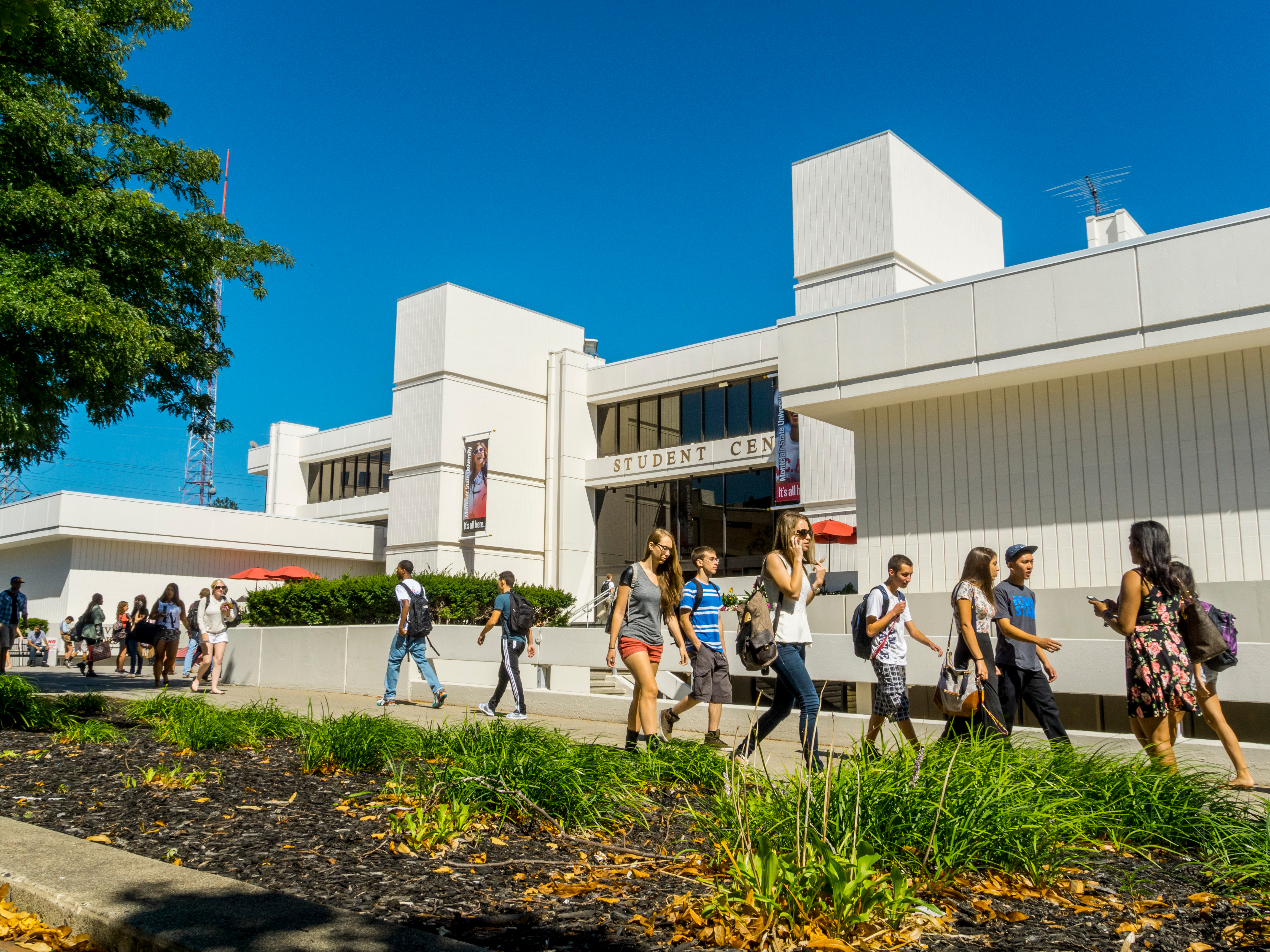 students walking in front of building