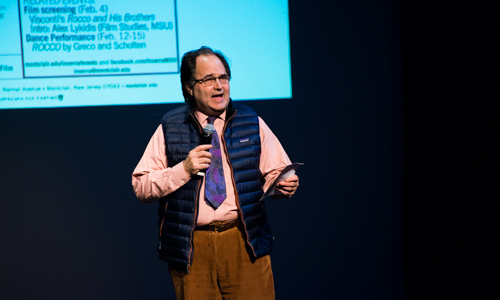 Man on stage speaking