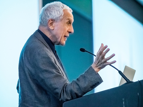 Man at lectern speaking