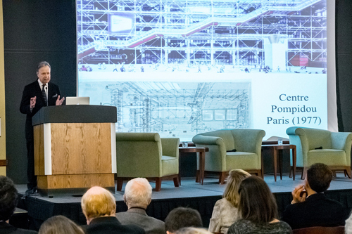 Man at lectern speaking