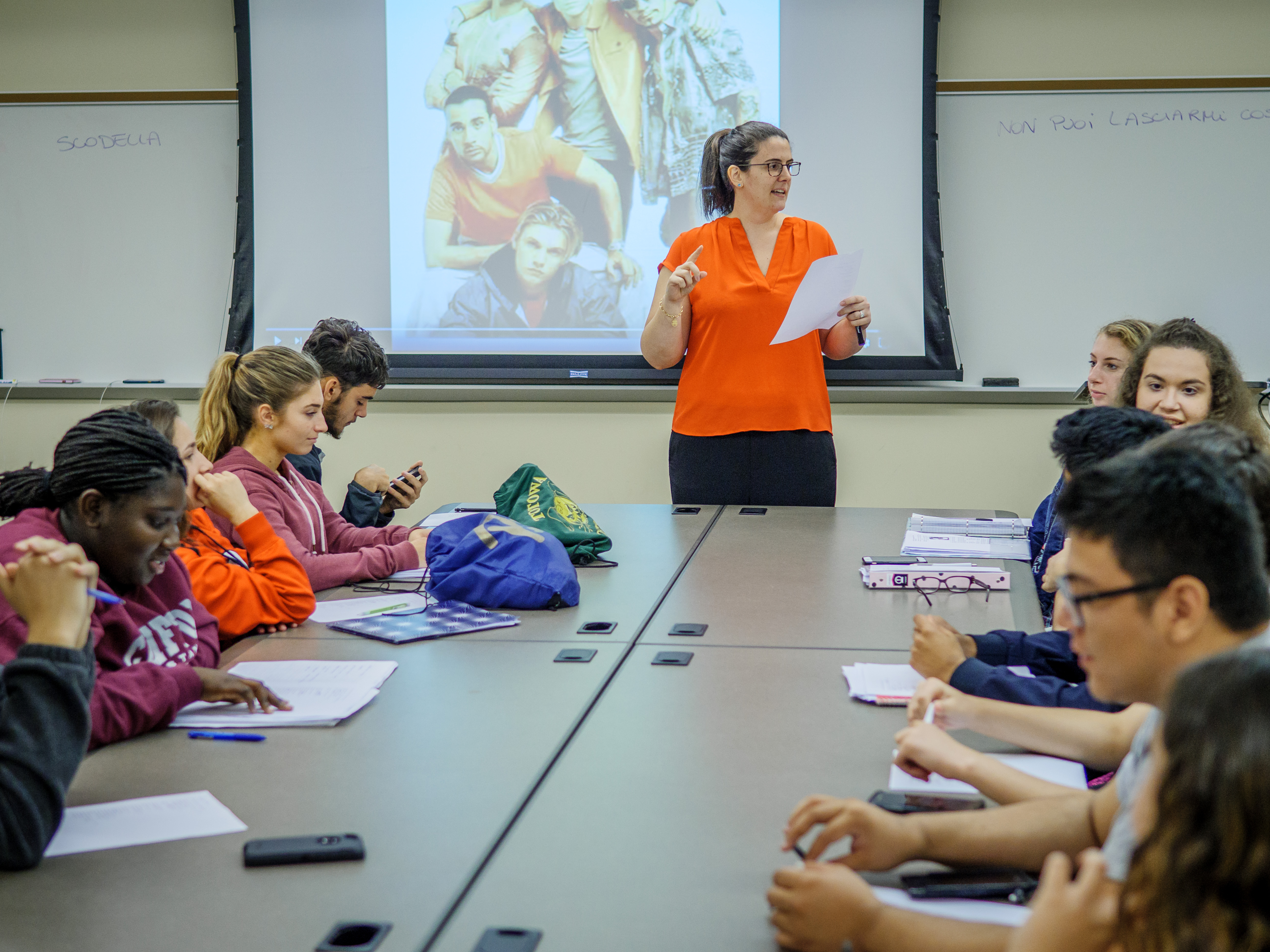 Teacher engages large group of students during Italian class