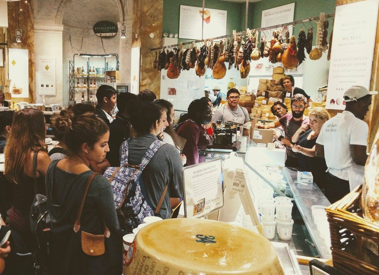 Group of high school students in an Italian marketplace learning about food and culture