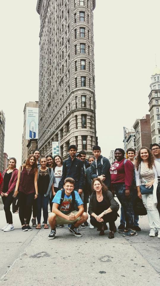 Large group of students in front of flat iron building in New York City