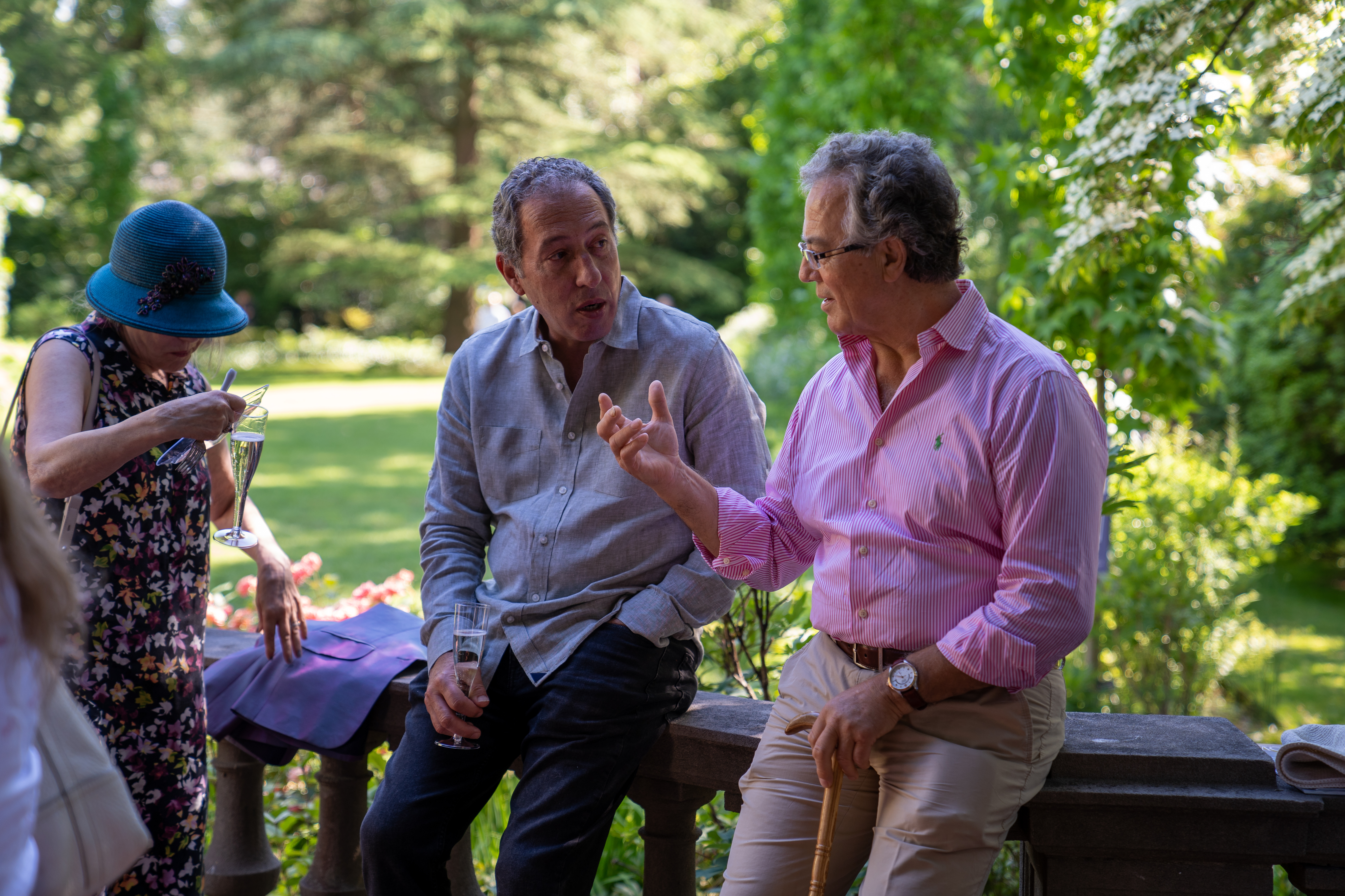 men sitting on wall talking