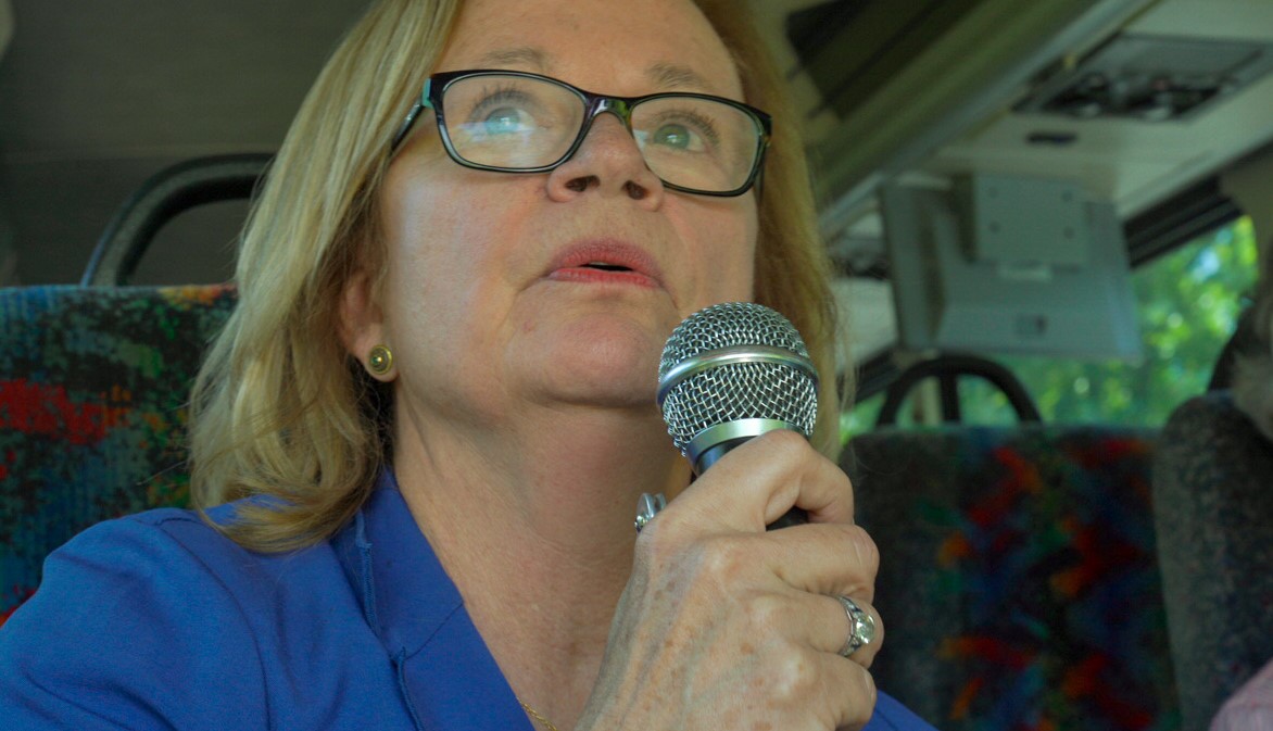 woman on bus with microphone