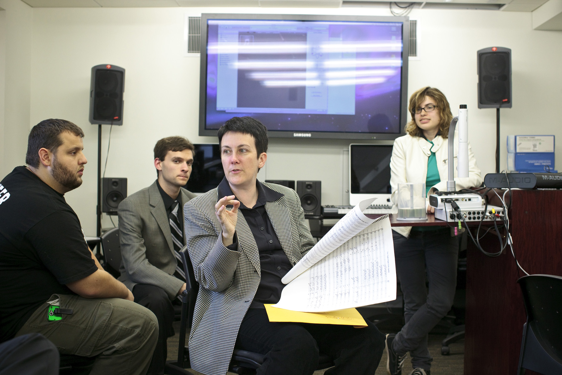 Several students, including Alyssa Menes (standing) played their compositions for Higdon and benefited from her coments.