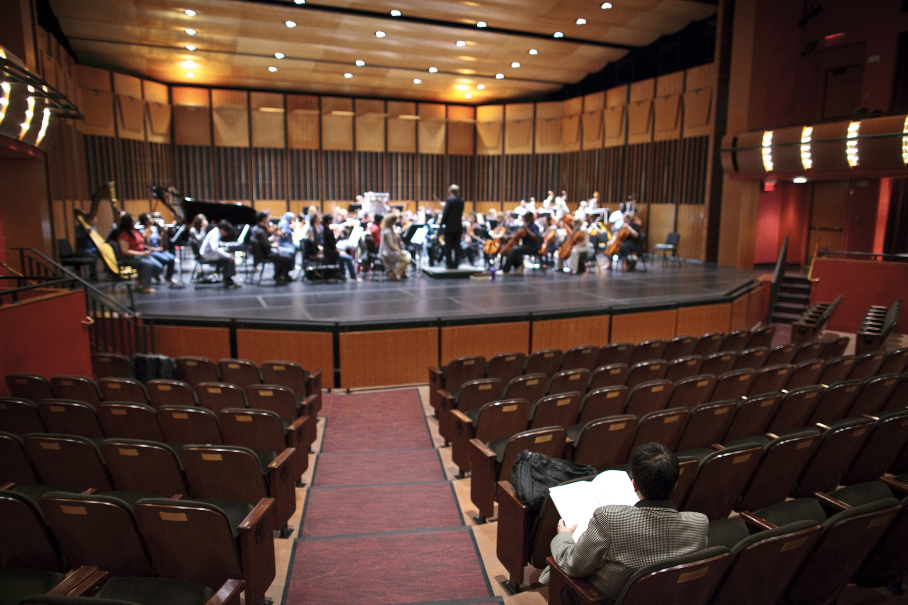 Higdon listens to a run through of her work, "blue cathedral" performed by the Montclair State University Symphony Orchestra in the Kasser Theater.