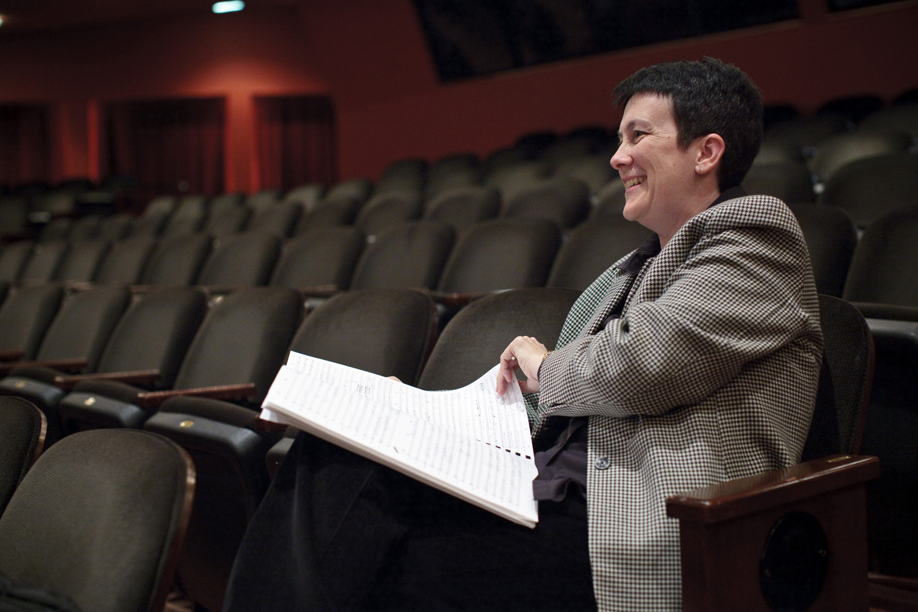 The composer reacts to what's happening on stage.