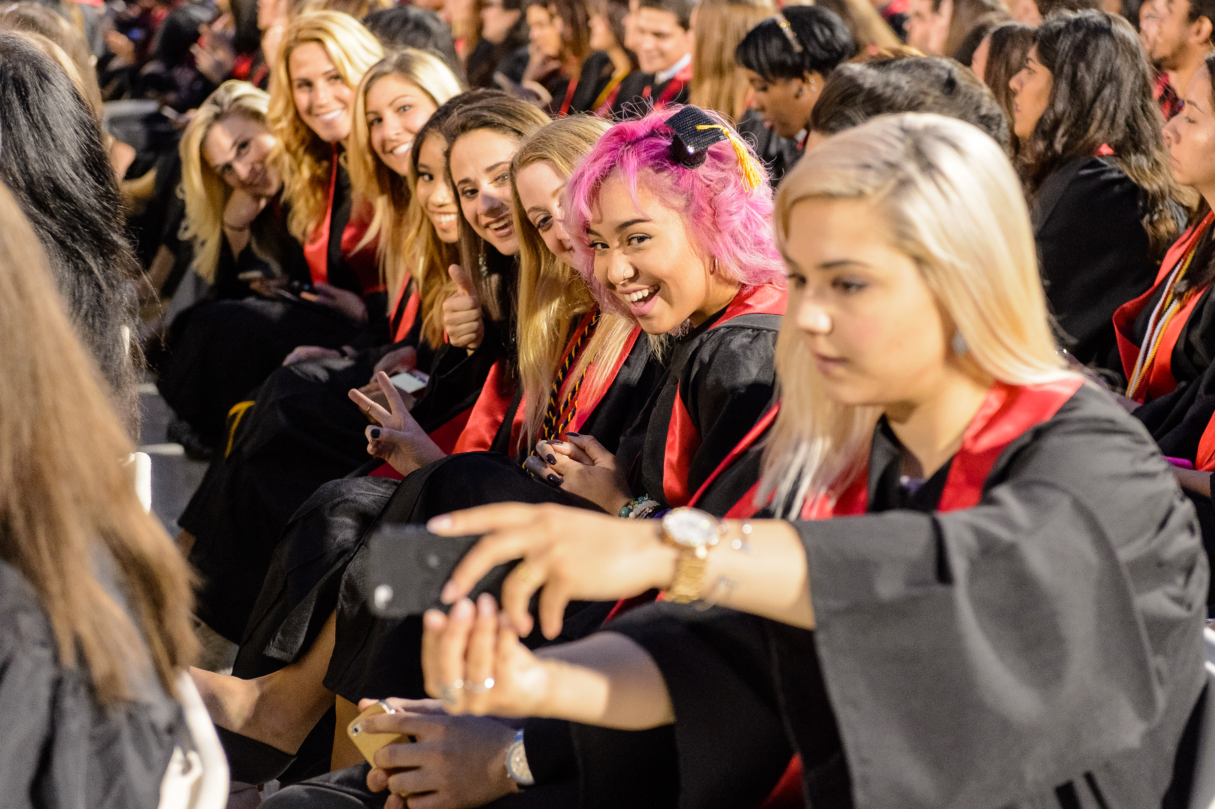 The College of the Arts graduates posing for photos at Convocation 2015.