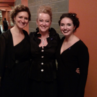 Dr. Heather J. Buchanan, Professor of Music and the Director of Choral Activities (center) and students at a recent performance.