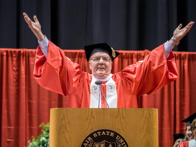Photo of James Patterson addressing the graduating class of 2014 at Commencement.